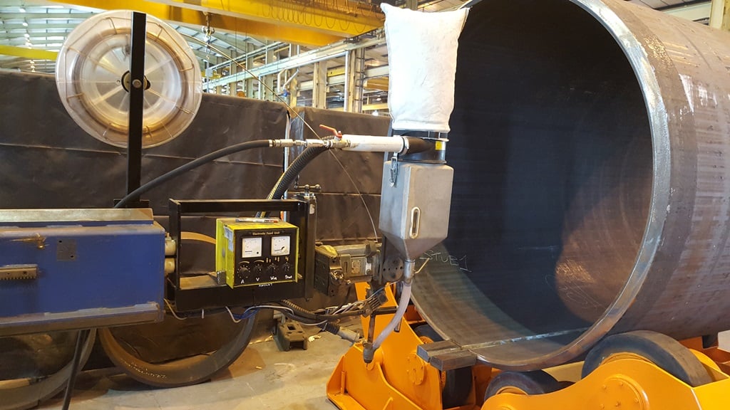 SAW with a column and boom welder